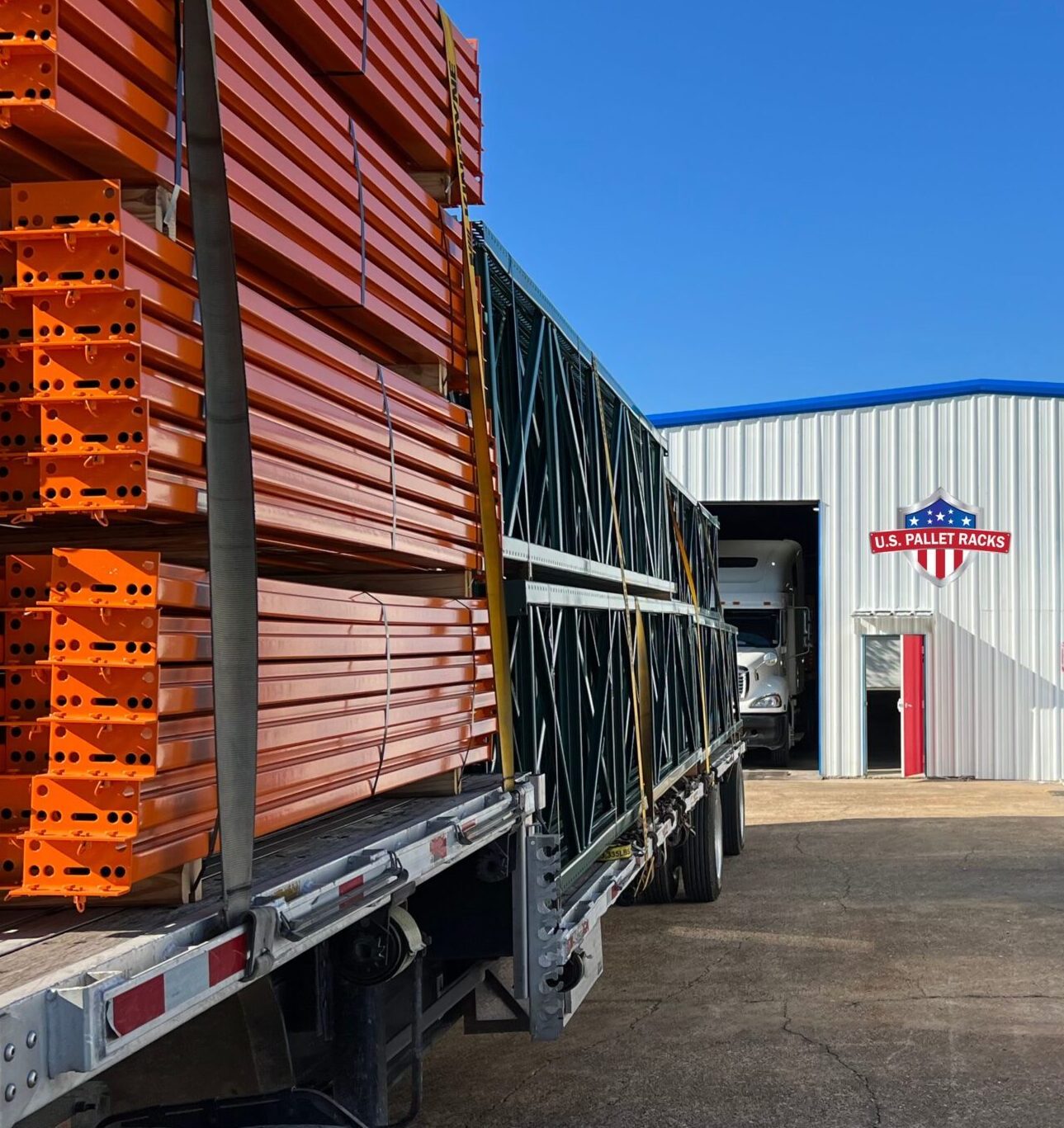 Pallet racks for sale loaded on flatbed trucks ready to depart from US Pallet Racks warehouse in Houston to a customer in Dallas, Texas.